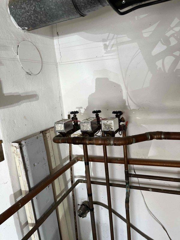 Responded to service call for boiler with non-functioning zones. Inspection revealed aged pressure gauge with significant wear and calibration issues. Serviced zone valves on copper distribution manifold, addressing flow restrictions and control valve functionality. System now operating with all zones providing heat properly.