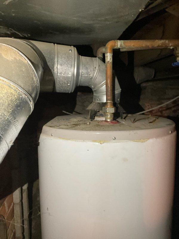 Conducted water heater assessment for CQ Quote #03552-02, inspecting existing unit in utility area. Observed aging tank with corrosion on connecting copper pipes, compromised valve system (red and yellow handles), and potential installation issues with the current setup. Recommended replacement with appropriate sizing and proper installation to ensure code compliance and optimal performance.
