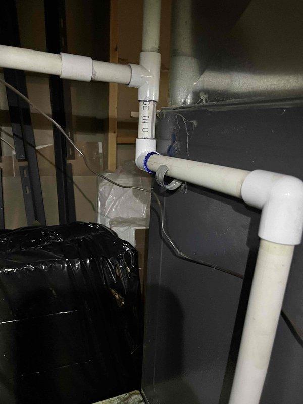 # Service Report

Responded to no heat call on 10+ year old furnace with reported water leakage and puddle formation on floor. Upon inspection, identified active condensate drain issue causing water accumulation near unit base. Inspected condensate drain line system including primary drain, trap assembly, and PVC discharge piping. Found condensate system experiencing drainage restriction preventing proper water removal from unit. Cleared obstruction from condensate line and verified proper trap configuration and pitch on discharge piping. Tested condensate pump operation and confirmed proper drainage flow. Cleaned condensate collection pan and verified no secondary overflow condition present. Cycled unit through complete heating operation and monitored condensate removal system for proper function. Confirmed no further water accumulation and proper drainage established. Unit restored to normal heating operation with all safety systems functional.