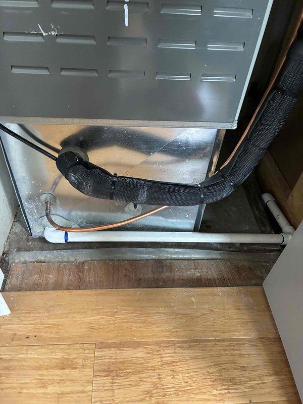 Completed installation of 2-ton air conditioning system with matching evaporator coil in rear yard location. Ran new dedicated electrical circuit to support the unit, completing all mechanical, electrical, and air conditioning work per code requirements. Installed Lennox digital thermostat inside residence, mounted indoor coil unit with proper condensate drain pan and refrigerant line connections, and verified all systems operational upon completion.