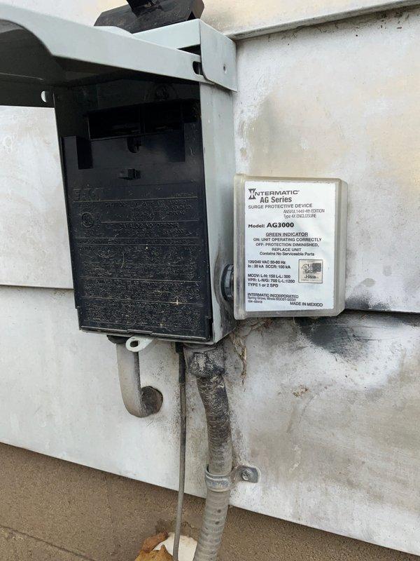 Completed preventative maintenance agreement visit for Club AC12-4 service on air conditioning and system inspection. Performed thorough inspection of indoor air handler unit, verifying proper control board operation and low-voltage wiring connections at System C terminal block. Inspected outdoor electrical disconnect panel and verified proper operation of Intermatic AG3000 Series surge protective device. All electrical connections, conduit, and system components found to be functioning within normal parameters.