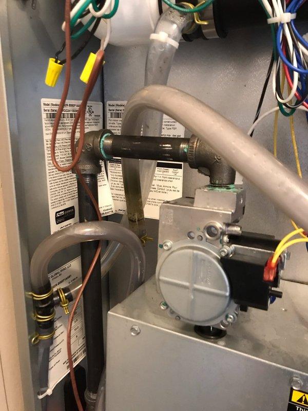 Completed scheduled maintenance agreement visit for air handler and split system. Performed comprehensive inspection of gas furnace interior components including gas valve assembly, heat exchangers, electrical connections, and refrigerant lines, verifying all components operating within manufacturer specifications. Inspected outdoor condensing unit, confirmed proper operation of compressor and condenser coil, noted normal weathering on exterior surfaces with unit functioning correctly for continued seasonal operation.