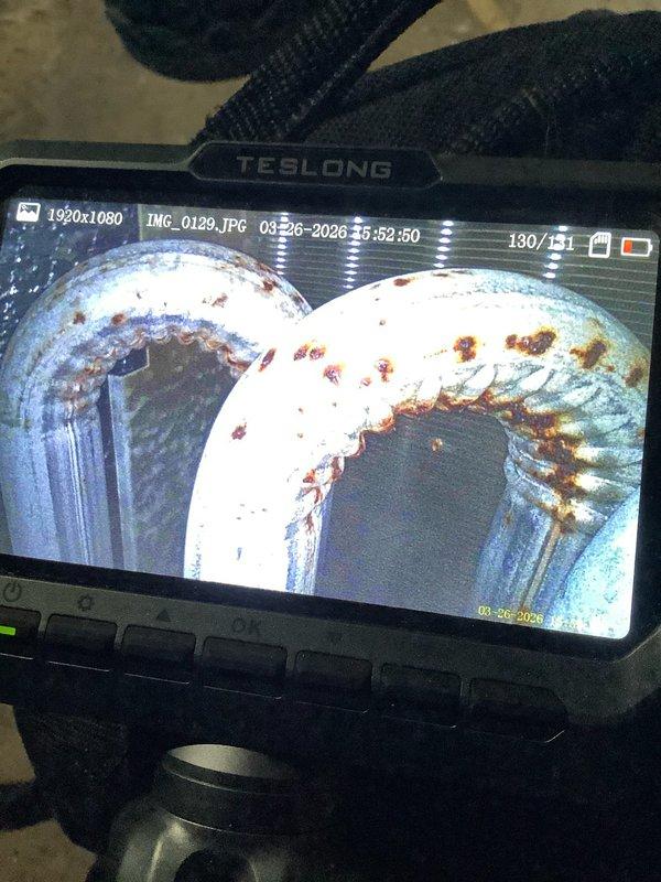 Responded to no heat call on furnace over 10 years old. Upon inspection, discovered significant rust and corrosion throughout the heat exchanger assembly, as documented with borescope camera imaging. The extensive deterioration posed safety concerns and compromised system integrity. Advised replacement of unit due to failed heat exchanger and age of equipment.