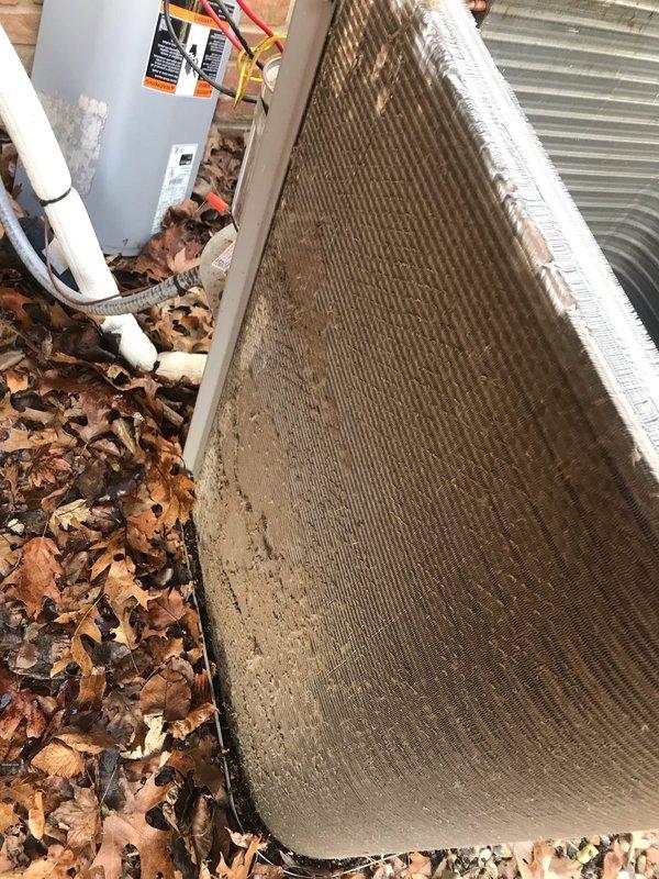 Completed Club AC12-4 agreement maintenance visit on Lennox HVAC system. Inspected furnace control boards and electrical connections, verified proper operation of SureLight control system, and examined all wire terminations at circuit boards and terminal blocks. Observed outdoor condenser unit with significant leaf debris accumulation around base and coil surfaces requiring attention during seasonal maintenance. Photographed control panel components and exterior equipment condition for service records.