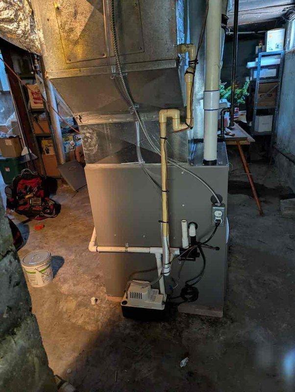 Completed installation of 70,000 BTU gas furnace in basement utility area, including all mechanical and electrical connections. Reconnected existing ductwork, installed condensate pump with drainage piping, ran gas line to unit, and verified proper operation of all system components upon completion.