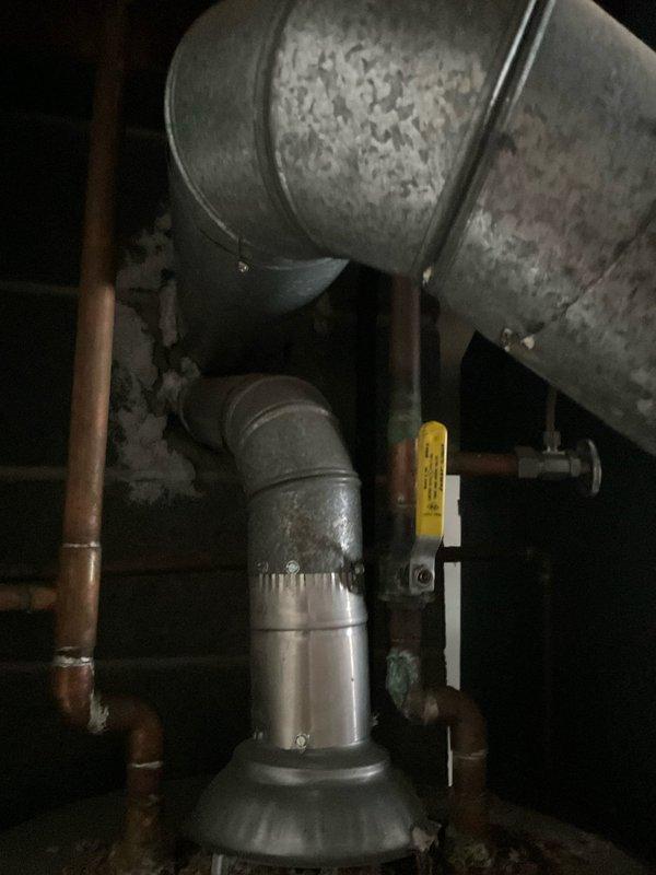 Provided comprehensive estimate for water heater replacement in residential utility space. Evaluated existing water heater installation, including current plumbing connections, venting configuration, and proximity to HVAC equipment. Documented existing copper supply lines, discharge piping, and safety system components. Assessed installation location constraints in basement mechanical room and clearance requirements for new unit. Photographed current equipment specifications and mechanical room layout to ensure accurate sizing and compliance with local plumbing codes for replacement installation.