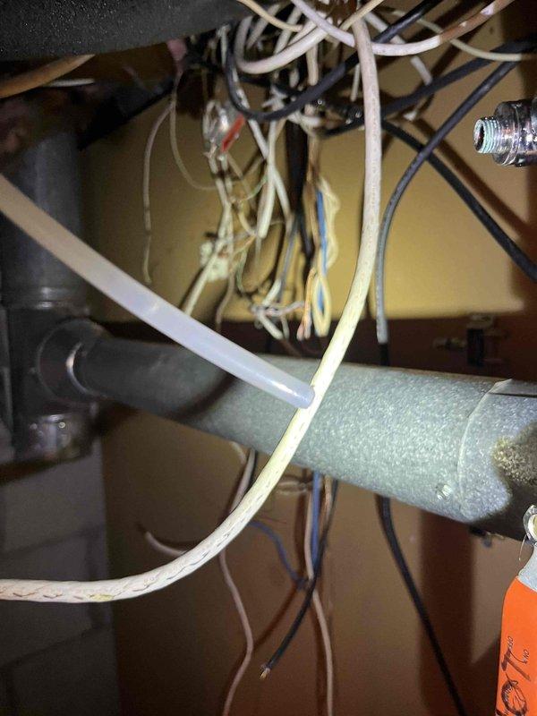 Responded to callback for reported refrigerant leak recurrence. Performed comprehensive system inspection and documented all components with photographs as requested. Inspected attic-mounted air handler unit, supply ductwork, and associated refrigerant lines. Examined condensate drain system including PVC drainage piping for proper operation. Verified all refrigerant line connections, joints, and fittings at the evaporator coil section. Checked electrical connections and control wiring for proper installation and secure terminations. Photographically documented ductwork installation, structural mounting, insulation integrity, and mechanical component configuration for service records. System inspection completed with full photographic documentation provided for review.