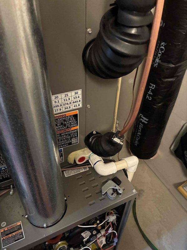 Completed installation of remaining LP conversion kit components on HVAC system. Relocated and secured refrigerant lineset in furnace room, raising copper lines higher on wall to improve clearance and prevent interference with other mechanical equipment and stored items. Verified all connections, tested system operation, and ensured proper refrigerant line insulation and support.