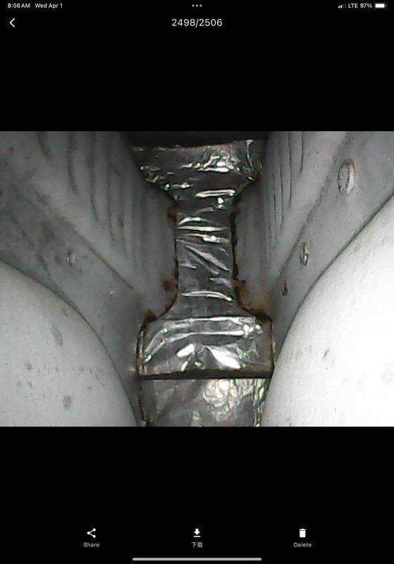 Completed preventive maintenance inspection on club AC8-12 system. Inspected ductwork connections and found loose joint requiring attention; secured and sealed duct connection with aluminum foil tape to prevent air leakage and maintain system efficiency. Identified rust staining on ceiling surface near HVAC components, indicating previous moisture intrusion or condensation issue; documented condition with photos for records. System operational at time of departure.