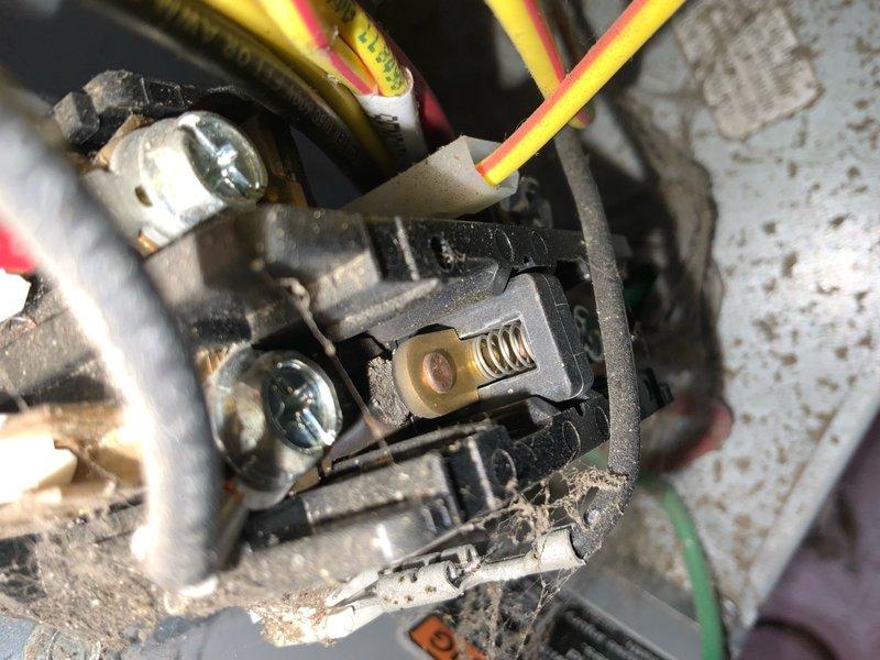 Responded to no cooling call on 10+ year old air conditioning system. Upon arrival, customer reported white foam discharge from line set when unit was activated. Inspected outdoor condensing unit and found failed contactor with visible arcing damage and deteriorated contacts. Contactor showed signs of age-related wear with accumulated debris and compromised spring mechanism. Replaced defective contactor with new unit, verified proper electrical connections at disconnect box, and confirmed all wire terminations were secure. Tested system operation and verified unit now cooling properly with no abnormal discharge from refrigerant lines.