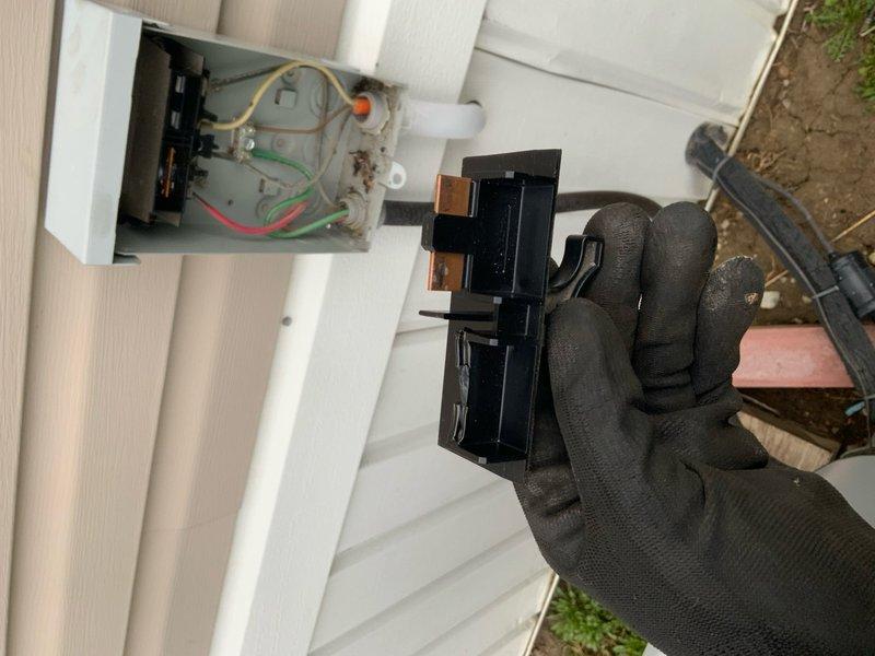 Responded to no cooling call on 10+ year old air conditioning system. Upon arrival, customer reported white foam discharge from line set when unit was activated. Inspected outdoor condensing unit and found failed contactor with visible arcing damage and deteriorated contacts. Contactor showed signs of age-related wear with accumulated debris and compromised spring mechanism. Replaced defective contactor with new unit, verified proper electrical connections at disconnect box, and confirmed all wire terminations were secure. Tested system operation and verified unit now cooling properly with no abnormal discharge from refrigerant lines.