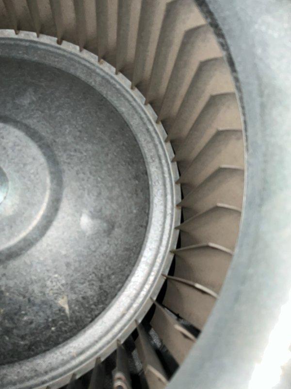 Completed routine CLUB AC 10-2 maintenance agreement visit for air conditioning and system inspection. Performed comprehensive evaluation of indoor air handler unit, including inspection of blower wheel assembly which showed normal operational wear on centrifugal fan blades and hub, confirmed proper blade alignment and clearances. Examined and documented condition of air filter, motor assembly, refrigerant line connections with brass fittings, and condensate drain system, verifying all components are functioning within normal parameters.