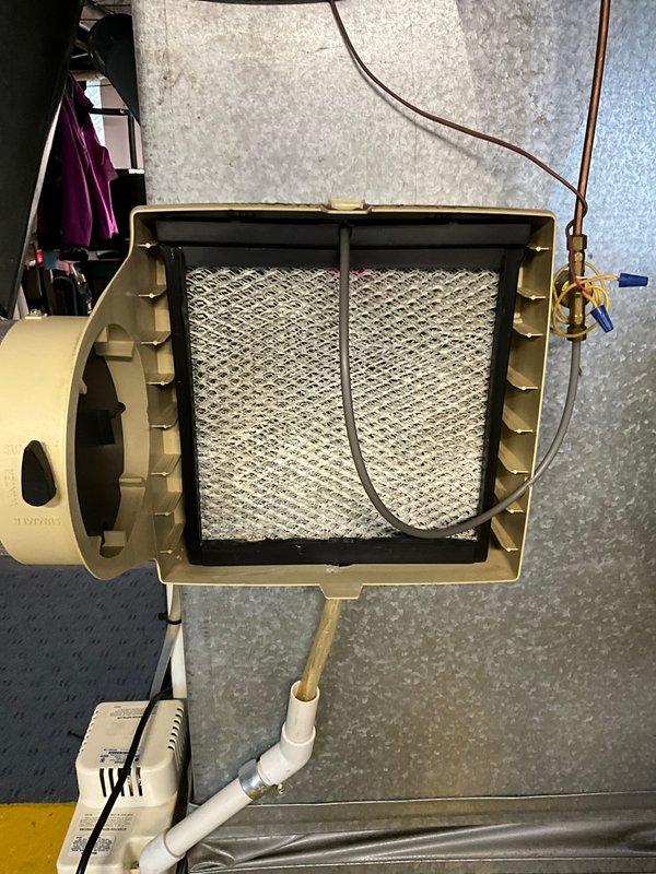 Completed routine CLUB AC 10-2 maintenance agreement visit for air conditioning and system inspection. Performed comprehensive evaluation of indoor air handler unit, including inspection of blower wheel assembly which showed normal operational wear on centrifugal fan blades and hub, confirmed proper blade alignment and clearances. Examined and documented condition of air filter, motor assembly, refrigerant line connections with brass fittings, and condensate drain system, verifying all components are functioning within normal parameters.