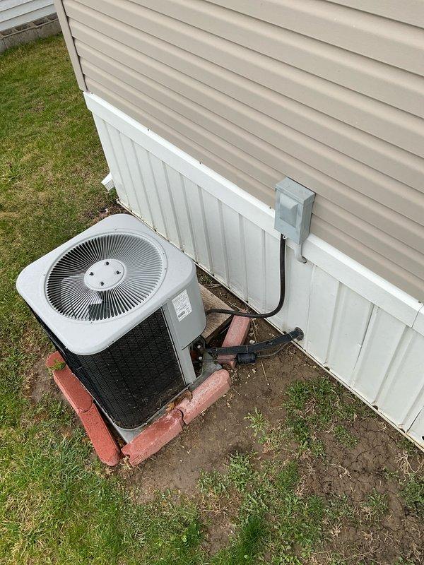 Completed on-site evaluation for HVAC system replacement at a mobile home residence. Assessed existing outdoor condensing unit mounted on concrete pad with proper electrical disconnect and evaluated indoor air handler/furnace unit installed in utility closet. Provided comprehensive quote options for both single component air conditioning replacement and complete system replacement to address customer's cooling and heating needs.