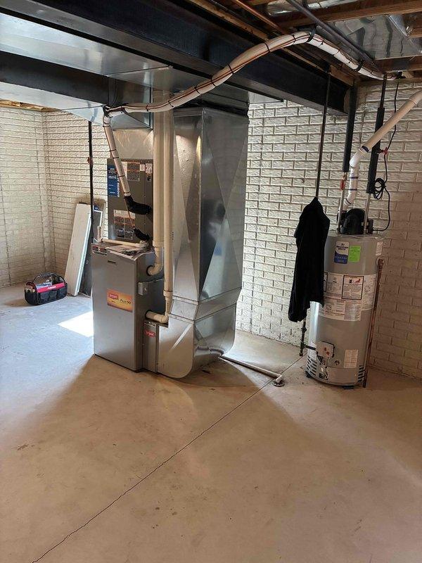 Completed installation of new air conditioning system and evaporator coil in residential basement location. System installed and integrated with existing furnace unit, with all ductwork connections properly sealed and secured. Financing documentation processed and approved, with required identification verified and maintained on file.