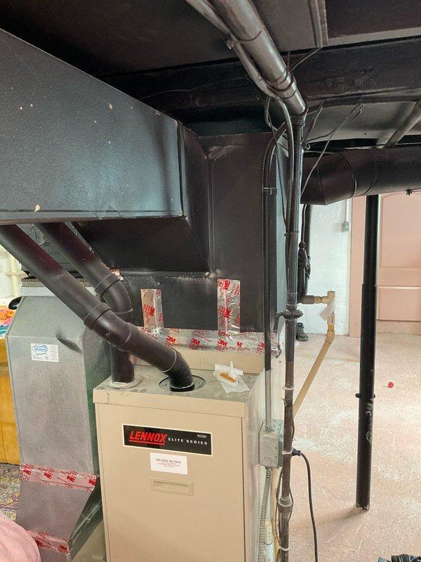 Conducted on-site replacement estimate for complete HVAC system including existing Lennox Elite Series furnace located in basement mechanical room and Lennox outdoor condensing unit. Evaluated current equipment configuration, ductwork layout including blue-gray metal trunk lines and black branch ducts, PVC venting system, and concrete pad placement for outdoor unit. Documented existing system specifications and captured detailed photos of both indoor and outdoor equipment to prepare comprehensive replacement proposal under quote numbers 03583-06 and 03583-03.