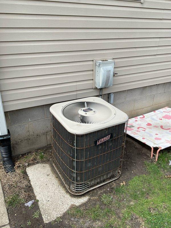 Conducted on-site replacement estimate for complete HVAC system including existing Lennox Elite Series furnace located in basement mechanical room and Lennox outdoor condensing unit. Evaluated current equipment configuration, ductwork layout including blue-gray metal trunk lines and black branch ducts, PVC venting system, and concrete pad placement for outdoor unit. Documented existing system specifications and captured detailed photos of both indoor and outdoor equipment to prepare comprehensive replacement proposal under quote numbers 03583-06 and 03583-03.