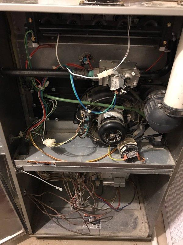 Completed Club AC8-12 preventive maintenance agreement visit on residential HVAC system. Performed comprehensive inspection of furnace unit including visual examination of gas valve assembly, blower motor, electrical connections, and control board. Documented system condition with interior component photography showing all major components operating within normal parameters. Verified proper wire connections, checked control board functionality, and confirmed all safety devices in working order. System operating efficiently with no immediate repairs required at this time.
