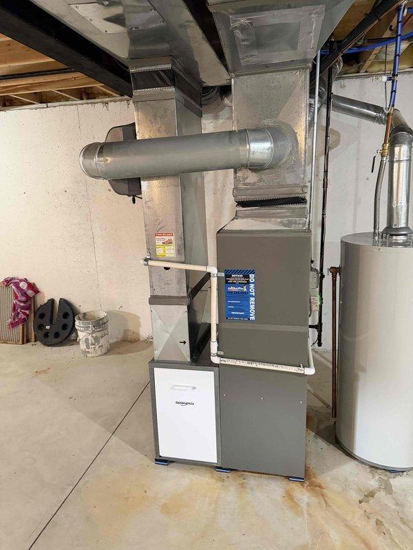 Responded to callback for expansion tank support installation to address permit compliance issue. Inspected residential HVAC system and plumbing configuration in basement mechanical room, verified proper support bracket installation for expansion tank mounted near water heater, and documented completed work with photographs showing furnace, ductwork, PEX supply lines, and properly secured expansion tank meeting code requirements.