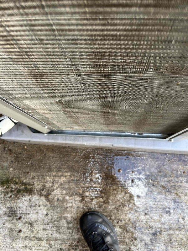 Completed Club AC10-2 preventive maintenance agreement visit on air conditioning system and supplemental installation. Performed standard inspection of heat exchanger coils, which showed moderate dust and dirt accumulation on fins, and documented existing environmental conditions including moisture staining on surrounding masonry and structural components. All equipment operational within normal parameters upon completion of scheduled maintenance protocol.