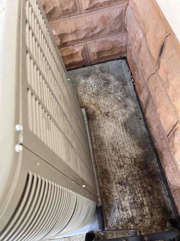 Completed Club AC10-2 preventive maintenance agreement visit on air conditioning system and supplemental installation. Performed standard inspection of heat exchanger coils, which showed moderate dust and dirt accumulation on fins, and documented existing environmental conditions including moisture staining on surrounding masonry and structural components. All equipment operational within normal parameters upon completion of scheduled maintenance protocol.