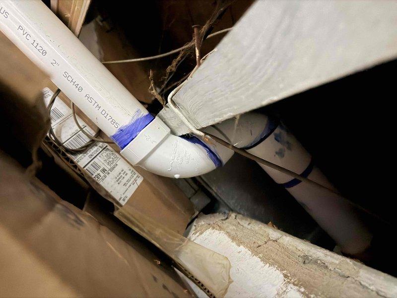 Responded to callback for cellucore venting replacement to address permit compliance issue. Removed existing non-compliant cellucore vent piping and installed new Schedule 40 PVC vent pipe system per code requirements. Secured all new PVC piping with proper strapping and supports, routed exterior vent termination through building envelope, and verified proper pitch and clearances throughout installation. System tested and operational upon completion.