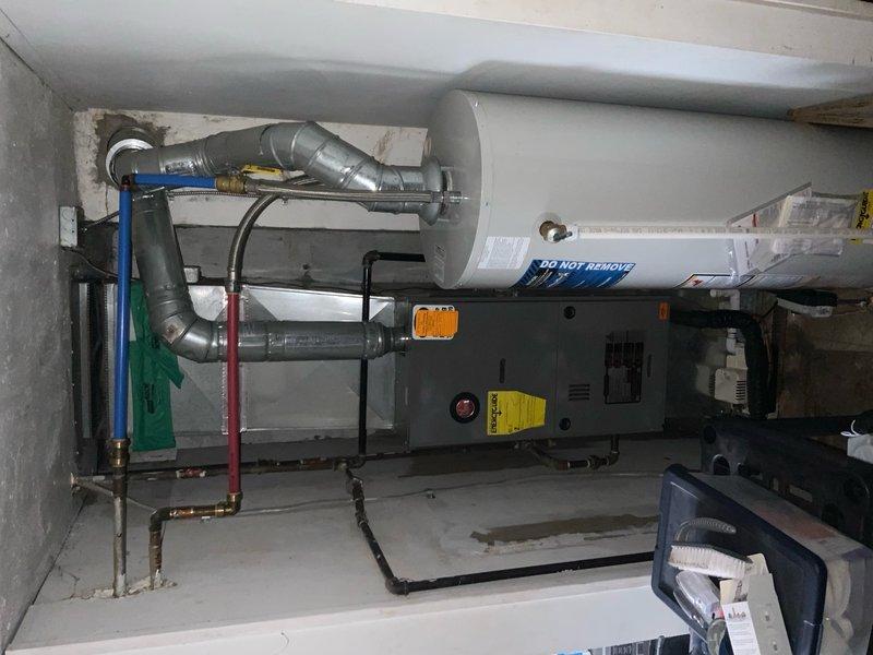 Responded to callback for water heater pilot light outage. Upon arrival, inspected horizontal water heater installation and HVAC system in basement utility area. Verified pilot assembly operation, checked gas supply line connections, and examined venting system for proper draft. Relit pilot light and confirmed burner ignition sequence. Tested thermocouple and gas valve functionality to ensure reliable pilot retention. System returned to normal operation with stable pilot flame and proper heating cycle.