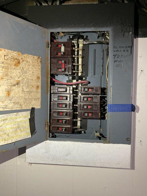 Performed comprehensive assessment of existing 25-year-old furnace and air conditioning system in single-family residence to provide replacement estimate. Documented aging HVAC equipment with minimal AC functionality, photographed furnace installation in confined utility space showing outdated ductwork configuration, and evaluated electrical panel capacity for new equipment installation requirements.