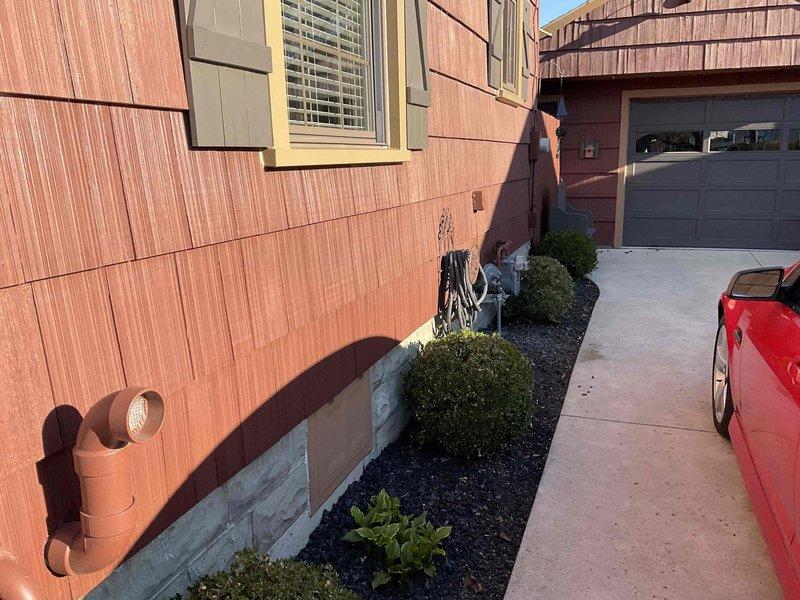 Conducted estimate for air conditioning system replacement at residential property. Existing outdoor condenser unit utilizes R-22 refrigerant, which is obsolete and makes repair economically unfeasible. Evaluated current equipment condition, documented installation location on concrete pad adjacent to deck area, and assessed electrical service routing through exterior-mounted conduit. Prepared multiple replacement options for new air conditioning system with modern refrigerant to restore cooling capacity.