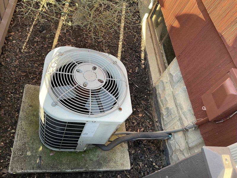 Conducted estimate for air conditioning system replacement at residential property. Existing outdoor condenser unit utilizes R-22 refrigerant, which is obsolete and makes repair economically unfeasible. Evaluated current equipment condition, documented installation location on concrete pad adjacent to deck area, and assessed electrical service routing through exterior-mounted conduit. Prepared multiple replacement options for new air conditioning system with modern refrigerant to restore cooling capacity.