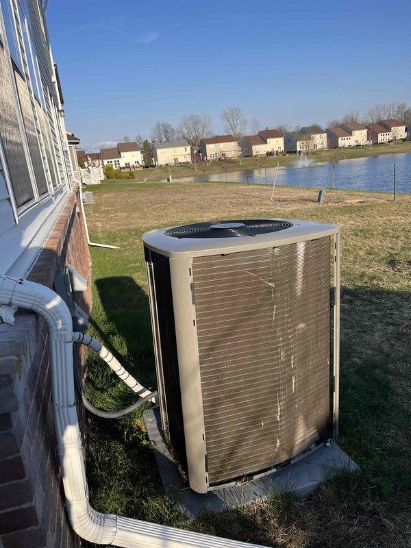 Responded to storm damage service call for residential AC unit that had tipped over during severe weather event. Upon arrival, found outdoor condensing unit displaced from original position but refrigerant lines and electrical connections still intact. Carefully repositioned unit onto existing concrete pad, ensuring proper levelness and stability. Verified all mounting hardware secure, checked refrigerant line connections for damage, and confirmed electrical disconnect and wiring remained undamaged. Unit restored to upright operational position on pad with proper clearances maintained from structure.