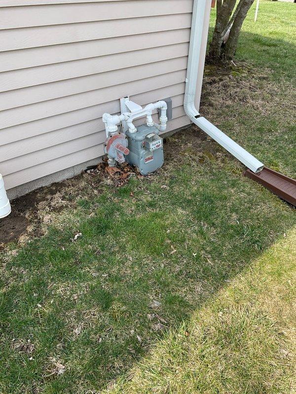 Conducted on-site HVAC system evaluation for equipment replacement estimate. Documented existing furnace and air conditioning unit model numbers and specifications. Photographed current equipment installation including basement furnace unit and exterior condensing unit location near gas meter to provide accurate system assessment for replacement options.