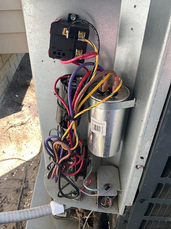Completed routine CLUB AC 12-4 maintenance agreement visit on air conditioning system. Inspected outdoor condensing unit electrical components, including contactor assembly and run capacitor, verifying all terminal connections were secure and wiring properly bundled. Measured compressor inrush amperage at 3.13A using digital multimeter, confirming normal startup characteristics and proper electrical performance within manufacturer specifications.