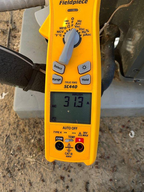 Completed routine CLUB AC 12-4 maintenance agreement visit on air conditioning system. Inspected outdoor condensing unit electrical components, including contactor assembly and run capacitor, verifying all terminal connections were secure and wiring properly bundled. Measured compressor inrush amperage at 3.13A using digital multimeter, confirming normal startup characteristics and proper electrical performance within manufacturer specifications.