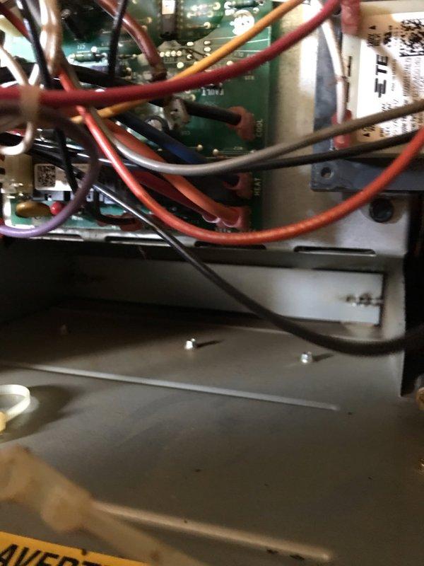 Completed annual AC maintenance tune-up as part of prepaid membership agreement. Performed comprehensive system inspection including electrical connections, control board components, and interior housing. Inspected circuit boards, capacitors, wiring terminals, and all electrical connections for proper operation and safety. Verified condensate pan and drain system condition. Documented system components with photographs showing control boards, wiring configurations, and internal assembly. All components found operating within normal parameters with no immediate repairs required. System ready for cooling season operation.