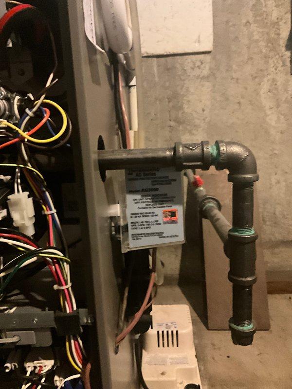 Completed annual AC maintenance tune-up as part of prepaid membership agreement. Performed comprehensive system inspection of outdoor condenser unit and indoor components, including examination of coil conditions, gas line connections, and electrical control systems. Documented equipment condition with photos showing condenser coils in operational status with normal outdoor weathering, properly assembled gas piping with code-compliant marking tape, and organized electrical wiring connections in control panel.