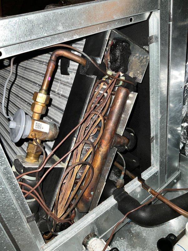 Completed preventative maintenance agreement visit for AC system. Inspected refrigerant lines, heat exchanger coil, and blower assembly. Found significant dust and debris accumulation on blower wheel and internal components. Documented system condition with photos showing oxidized copper refrigerant lines, evaporator coil, and heavily soiled blower wheel requiring cleaning. All components inspected per maintenance agreement specifications.