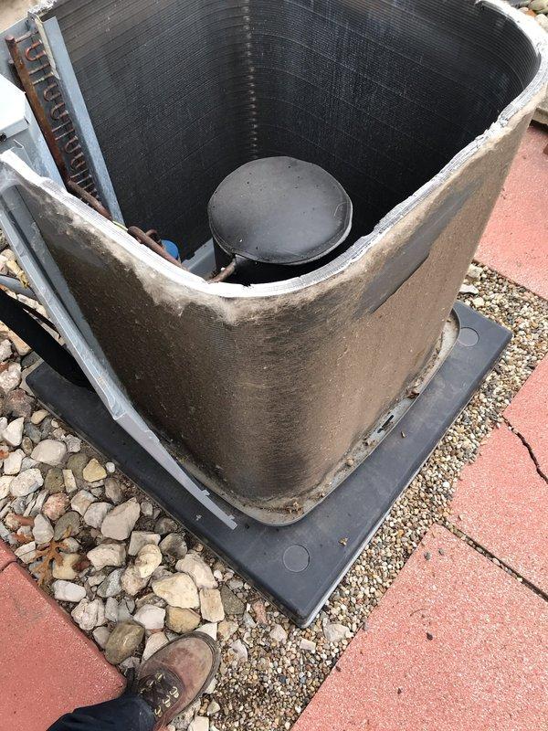 Completed annual air conditioning maintenance tune-up on residential AC system as part of prepaid membership agreement. Performed comprehensive inspection of outdoor condenser unit, including examination of cylindrical condenser coil assembly, compressor components, and refrigerant lines. Verified proper operation of all system components with no issues found or repairs required at this time.