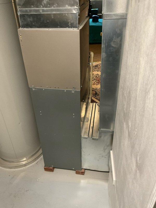 Completed on-site assessment of existing furnace system installed in 2004 showing signs of age-related deterioration. Documented current HVAC equipment configuration in basement utility area, including furnace unit with beige cabinet base and metal ductwork components. Provided comprehensive estimate for single-component furnace replacement to address aging equipment and ensure continued system reliability.
