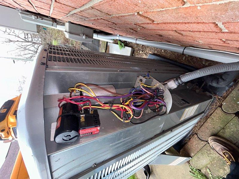 Completed preventative maintenance inspection under Club AC12-4 agreement. Inspected indoor air handler blower wheel assembly, confirmed squirrel cage fan operational with all radial fins intact and motor connections secure. Examined outdoor condensing unit and associated electrical components including power supply, terminal connections, and wiring harness. Noted debris accumulation in exterior equipment area and gutter system requiring routine cleaning to maintain proper drainage and equipment access.