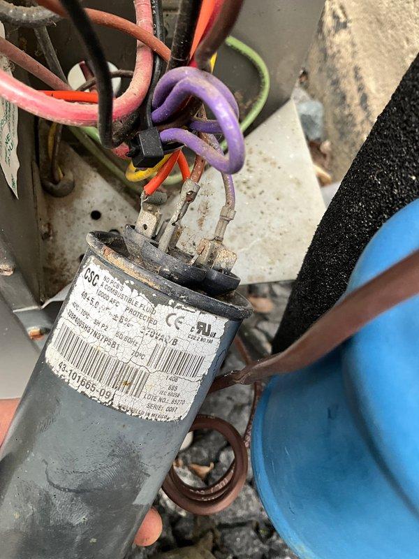 Completed annual AC maintenance visit as part of prepaid membership agreement. Performed comprehensive system tune-up including inspection of blower wheel assembly and electrical components. Blower wheel showed normal operational wear with no significant deterioration noted. Inspected and evaluated dual-run capacitor with multiple wire connections, confirming proper terminal connections and component integrity. Verified all electrical connections secure and free from damage. System operational and functioning within normal parameters upon completion of maintenance service.