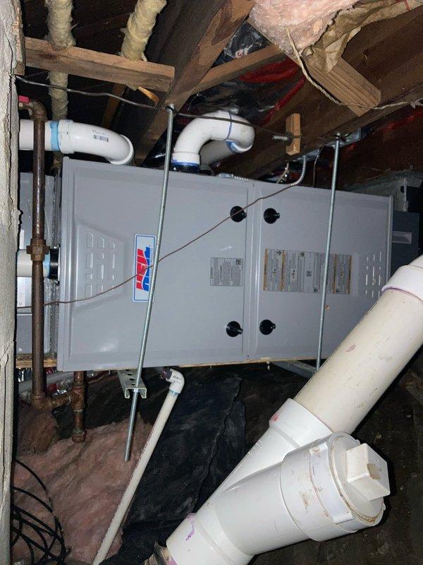Completed routine preventative maintenance agreement visit for residential air conditioning system and supplemental inspection. Performed comprehensive inspection of attic-mounted HVAC unit, including examination of furnace assembly, PVC intake and exhaust venting, refrigerant line connections with foam insulation, and electrical components. Conducted detailed blower motor and fan assembly inspection, confirming proper blade alignment, hub integrity, and centrifugal operation. All system components found operating within normal parameters with no immediate service needs identified. Unit photographed for maintenance records.