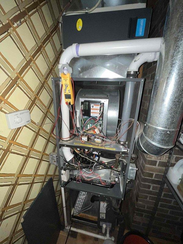 Completed scheduled AC maintenance tune-up on air conditioning system with vertical air handler installation. Performed comprehensive system inspection including electrical components, control board, blower motor assembly, and capacitor testing using diagnostic meter. All components operating within normal parameters, system tested and confirmed ready for cooling season.
