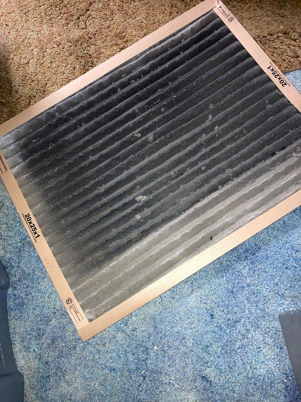 Completed scheduled AC maintenance tune-up on residential air conditioning system. Performed comprehensive inspection of blower wheel assembly, verifying proper operation and noting dust accumulation on housing slats and internal components. Inspected heavily soiled 20x25x1 air filter showing significant dirt and debris buildup, documented condition with photos for customer records. All system components operational and maintenance items addressed per agreement terms.