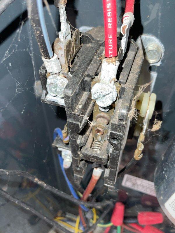 Completed preventive maintenance tune-up on air conditioning system. Performed comprehensive inspection of blower motor assembly, verifying proper operation of motor windings and electrical connections. Inspected and tested contactor relay mechanism, confirmed all terminal connections secure despite visible age-related oxidation on contact points. Documented equipment condition with photos showing normal wear patterns consistent with system age. All components operating within manufacturer specifications at time of service.