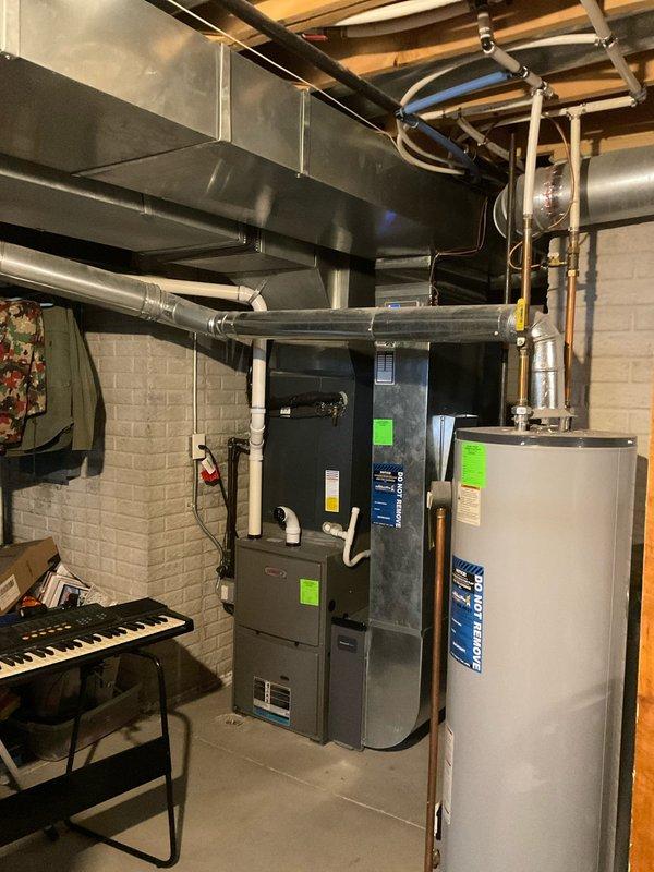 Conducted comprehensive assessment of existing water heater installation in basement mechanical room for replacement estimate. Evaluated current unit configuration, including copper supply piping connections, venting requirements through existing galvanized ductwork, and clearances relative to adjacent furnace system. Documented equipment specifications, existing plumbing connections, and spatial constraints for proper sizing and installation planning of new water heater unit.