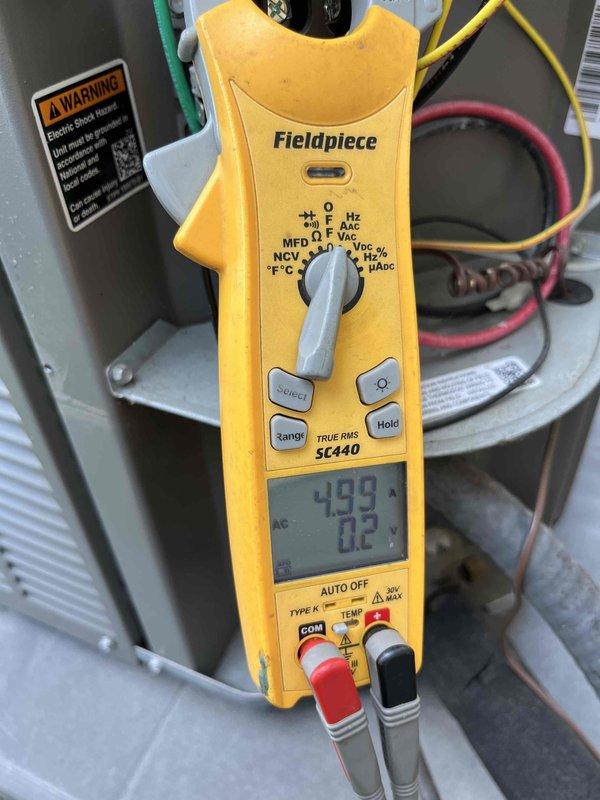 Completed scheduled air conditioning maintenance agreement visit per club membership plan. Performed comprehensive system diagnostics using Fieldpiece SC440 clamp meter to verify electrical parameters and operational performance. Measured voltage readings of 499V and 344.1V at key system components to ensure proper power supply and equipment function. Inspected outdoor condensing unit, evaluating compressor operation, motor performance, and overall system integrity. Checked electrical connections and wiring throughout the unit, confirming secure terminations and proper routing of power conductors. Applied pipe putty as needed for system protection and maintenance requirements. All measurements confirmed system operating within normal parameters. Unit running efficiently with no immediate service concerns identified.