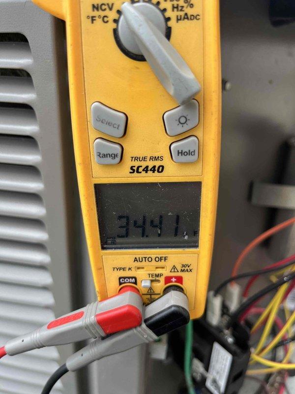 Completed scheduled air conditioning maintenance agreement visit per club membership plan. Performed comprehensive system diagnostics using Fieldpiece SC440 clamp meter to verify electrical parameters and operational performance. Measured voltage readings of 499V and 344.1V at key system components to ensure proper power supply and equipment function. Inspected outdoor condensing unit, evaluating compressor operation, motor performance, and overall system integrity. Checked electrical connections and wiring throughout the unit, confirming secure terminations and proper routing of power conductors. Applied pipe putty as needed for system protection and maintenance requirements. All measurements confirmed system operating within normal parameters. Unit running efficiently with no immediate service concerns identified.