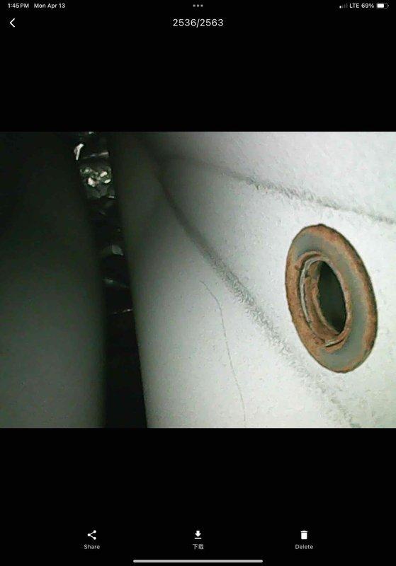 Completed annual maintenance visit on 19-year-old air conditioning and furnace system. Performed comprehensive AC tune-up including inspection of evaporator coils, which showed normal wear consistent with system age. Noted significant discoloration and debris accumulation in drain pan requiring monitoring for potential drainage issues. Inspected air handler interior components and documented rust staining around penetration points indicating possible moisture concerns. All systems operational at time of service. Photographed conditions for service records.