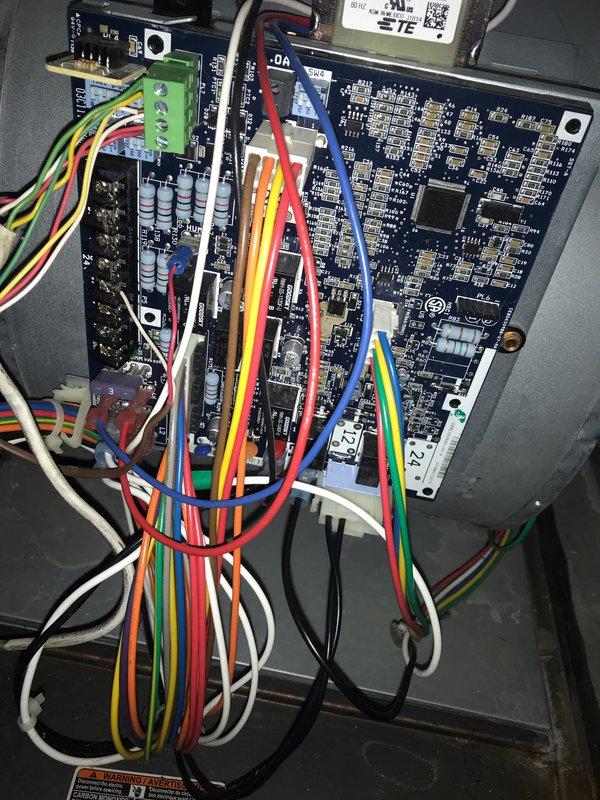 Completed prepaid AC maintenance tune-up on residential air conditioning system. Performed comprehensive inspection of outdoor condenser unit, indoor evaporator coil, and control board assembly. Inspected blower motor housing and ventilation components for proper airflow. Examined electronic control boards, terminal connections, and wiring harness for secure connections and proper operation. Verified all electrical components, capacitors, and integrated circuits functioning within normal parameters. System operating efficiently with no deficiencies noted at time of service.